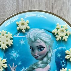 there is a frozen princess cake on the plate