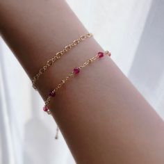 "* DETAILS* This dainty bracelet is a perfect gift to the one you love or to yourself. A nice every day bracelet. - AAA+ Natural Ruby Beads - 24k Gold Filled Chain - 14K GOLD FILLED Wire - 14k Gold Filled Spring Ring Clasp - 14k Gold Filled Link Rings - Bracelet has a 1\" Extension with gold filled ball charm. ✨All components are gold filled. 👉🏻For more birthstone bracelets, see https://www.etsy.com/shop/JinnysJewelryBySeJin You may also like 🌟Sapphire Bracelet. https://www.etsy.com/JinnysJew Affordable Dainty Bracelets For Birthday Gift, Affordable Cute Bracelets For Birthday, Affordable Dainty Jewelry For Birthday Gift, Red Ruby Bracelet, Stackable Necklaces, Balance Bracelet, Minimal Bracelet, Carnelian Bracelet, Ruby Bracelet