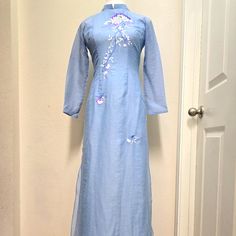 Nwot. Ao Dai Only. No Pant. Size M. Vi T Xc. 4 Ta. 4 Layers With Beautiful Embroidery. Light Blue Color. Preferred Care: Hand Wash And Air Dry. Please See Pictures For Details Or Any Markings/ Flaws. Let Me Know If You Need Additional Photos With Measurements. Summer Fitted Blue Ao Dai, Fitted Blue Ao Dai For Summer, Blue Ao Dai For Summer, Spring Embroidered Blue Ao Dai, Fitted Light Blue Ao Dai For Spring, Blue Fitted Long Sleeve Ao Dai, Embroidery Light, Light Blue Color, Beautiful Embroidery