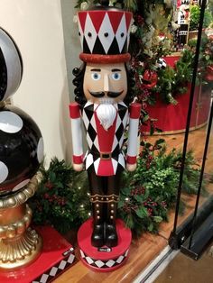 a nutcracker statue sitting on top of a wooden table