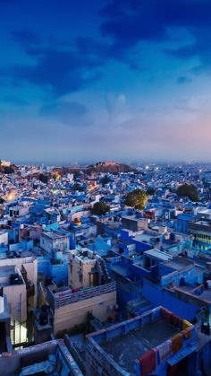 an aerial view of a city at dusk