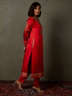 Editor's Note Elevate your ethnic look with our red ari-hand embroidered girija kurta, paired with churidar and a coordinating dupatta. This ensemble combines traditional charm with intricate hand embroidery, perfect for special occasions and celebrations. Fabric: Silk satin Color: Red Components: Kurta, churidar and dupatta Occasion: Festive Note: Product colour may slightly vary due to photographic lighting sources Care: Dry clean only About the DesignerRi Ritu Kumar is one of India’s foremost Festive Semi-stitched Straight Kurta Salwar Kameez, Red Sets With Dabka For Traditional Ceremonies, Traditional Festive Unstitched Suit With Dabka, Traditional Unstitched Suit With Dabka For Festive Occasions, Bollywood Style Red Unstitched Suit For Transitional Season, Transitional Bollywood Red Unstitched Suit, Festive Chikankari Embroidered Raw Silk Churidar, Festive Raw Silk Churidar With Chikankari Embroidery, Traditional Red Kurta With Dabka