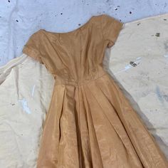 Beautiful 40s ochre taffeta cocktail dress. Metal side zip enclosure. Shoulders 13. 75”Chest 33/ a snug 34”Waist 24”Hips freeFront length 40”Side zip Very good condition for it’s age- some overall wear. Some light stress at seams in usual places. Overall presents beautifully, sturdy and wearable as is. Vintage Fitted Taffeta Dress, Fitted Vintage Taffeta Dress, Vintage 40s, Side Zip, Dress Shop, Overalls, Short Sleeve Dresses, Cocktail Dress, Summer Dresses