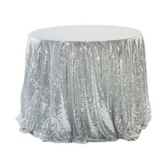 a silver sequin tablecloth on a white background