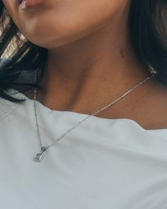 Brighten up everyday with the Cassia Pendant Necklace! A shining CZ stone in a simple pendant adds a touch of sparkle to any outfit. This chic accessory is sure to bring some shine to your day. Materials: 14K gold ﻿or﻿﻿ rhodium plated brass, cubic zirconia Features: Measures 16" with 2" extender, 1mm chain, 2mm beads, 0.6" pendant, 4.5mm CZ stone, Lead & Nickel free, lobster clasp Everyday Diamond Jewelry With Sparkling Stones, Elegant Everyday Crystal Necklaces, Everyday Sparkling Diamond Jewelry, Everyday Jewelry With Sparkling Cubic Zirconia Stones, Everyday Silver Cubic Zirconia Solitaire Necklace, Everyday Dazzling Cubic Zirconia Jewelry, Dazzling Silver Necklace For Everyday, Everyday Diamond White Cubic Zirconia Jewelry, Cubic Zirconia Square Pendant Necklace For Gifting