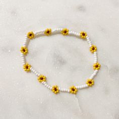 Handmade seed bead bracelet or anklet (see sizing)  Each flower bracelet stretches up to roughly 2.5cm easily while wearing Simple strand bracelets (aka no flowers) have less forgiving stretch than flower bracelets. If you are in between sizes, I recommend sizing up!  Use code 2FOR10BRACELETS when purchasing 2 bracelets valued $6 or more Find us on instagram & tag us for a chance to win a free sticker! https://www.instagram.com/daintydaisybeadco/ Mini Seed Bead Bracelets, Bracelet Design Beads, Beads Bracelet Design Flower, Sunflower Bead Bracelet, Daisy Beads Bracelet, Pearl Bracelets Ideas, Seed Bead Bracelets Flower, Flower Seed Bead Bracelets, Seed Beads Bracelets Ideas