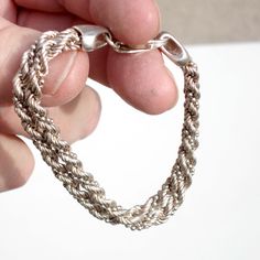 Wonderful double-stranded sterling silver bracelet - the links are twisted into a spiral. Stamped Milor, 925 and Italy. Measures 7 1/2 inches long. Width (both strands together) is 3/8 of an inch. Circa 1980. Sturdy construction with a large lobster claw clasp that closes securely. Weight is 16.4 grams or .58 oz. Excellent vintage condition with minor surface wear and some patina. Sterling Silver Bracelet With A Modern Twist, Elegant Twisted Silver Bracelets, Elegant Silver Twisted Bracelet, Silver Sterling Braided Bracelets For Everyday, Everyday Silver Sterling Braided Bracelets, Everyday Silver Sterling Silver Braided Bracelet, Silver Adjustable Twisted Bracelets, Adjustable Twisted Silver Bracelets, Modern Twist Sterling Silver Bracelets