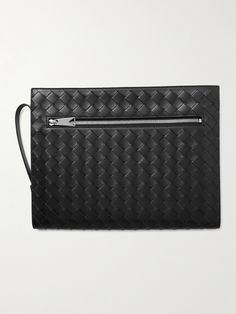 Bottega Veneta's 'Avenue B.' pouch is sized for a tablet, making it ideal for everything from boardrooms to travelling. It's made from black leather that's woven using the label's signature intrecciato technique and finished with a zipped pocket at the back. Designer Travel Wallets In Pouch Shape, Designer Travel Wallet Pouch, Designer Travel Pouch Wallets, Luxury Black Pouch With Zipper Closure, Designer Black Pouch For Travel, Designer Black Bag With Zipper Pouch, Designer Travel Pouch Clutch, Designer Black Clutch With Zipper Closure, Designer Clutch With Removable Pouch For Travel