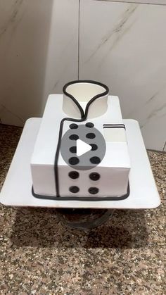 a cake that is shaped like a video game controller