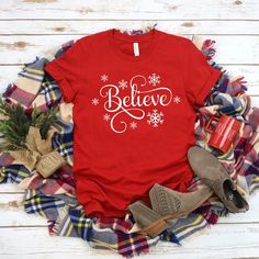 Christmas Shirts|Believe Christmas Shirt|Christmas Shirt Women's|Winter Shirt| Holiday Shirt|Gifts for Christmas|Family Shirts|Christmas Tee|Woman's plus size Christmas shirts.Choose a size and color from the drop down selection boxes.SIZING:Retail fit. Unisex . Please refer to size chart in photos. Recommend laying your current favorite tee flat and measuring it for a comparison.*Please check your order details and shipping address on your cart carefully before making payments.***Due to variati Festive Winter Shirt With Letter Print, Winter Gift Shirt With Letter Print, Winter Letter Print Shirt For Gift, Winter Letter Print Shirt Gift, Festive Red Winter Shirt, Womens Winter Shirts, Funny Thanksgiving Shirts, Plus Size Christmas, Believe Christmas