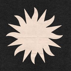 a black and white image of a sunflower on a piece of paper that has been cut out