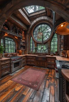 a kitchen with wood floors and large windows in it's center area, along with a rug on the floor