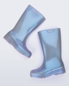 Meet the Melissa Welly, our take on galoshes. These bubble-gum-scented boots will help you get around in waterproof (and fashionable) style. Made of 100% Melflex, they’re recyclable and sustainable to boot. Sorry, we had to. Blue Waterproof Boots For Rainy Weather, Blue Weatherproof Boots For Rainy Weather, Weatherproof Blue Boots For Rainy Weather, Blue Round Toe Rain Boots, Trendy Weatherproof Rain Boots For Outdoor, Casual Blue Weatherproof Boots, Casual Weatherproof Blue Boots, Platform Shoes Boots, Fisherman Sandals