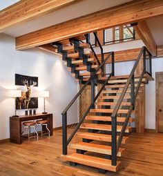 there is a wooden stair case in the house