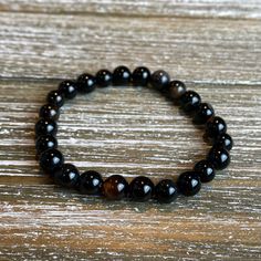 "Introducting the \"Blaze\" Collection! Beautiful individually or complete the look with a stack that makes a statement. vMix and match to find the look you love. Look stylish with an 8mm Natural Black Larvikite, 8mm Red Agate, 8mm Black Agate, and/or 8mm Smoky Quartz bead bracelet! Available accented with or without spacer beads and charms. (Please specify in the personalization section). Water proof and sturdy, yet shiny and chic! Held together with heavy duty stretchy bead cord. SIZING: Every Charm Bracelet Stack, Pearl Necklace Choker, Bracelets Charm, Black Bracelet, Black Bracelets, Bead Bracelets, Black Agate, Red Agate, Strand Bracelet