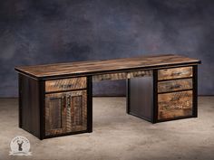 a desk made out of wood and metal with an open door at the top, sitting on a concrete floor