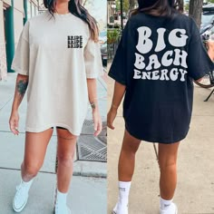 two women walking down the street wearing matching t - shirts that read big bach energy