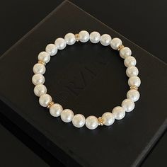 In a world saturated with mediocrity, nothing can rival the authenticity of traditional luxury. This subtly opulent bracelet showcases genuine white freshwater pearls, elegantly interspersed with lab diamond studded rondelles in gold. Hand-strung with care in our Orlando studio, this stretch bracelet adjusts over the wrist for easy transitions and offers versatile styling options with a comfortable wear. Our Men's Pearls Collection, features sophisticated fresh water pearl necklaces and bracelet Elegant Rondelle Crystal Bracelet Gift, Classic Gold Pearl Beaded Bracelets, Elegant Pearl Jewelry With Gold Beads, Formal Pearl Beaded Bracelets With Pearl Chain, Elegant Crystal Bracelet With Round Beads And Jubilee Style, Formal White Pearl Bracelets, Pearl White Pearl Beaded Jubilee Bracelets, Formal White Pearl Embellished Bracelets, White Pearl Embellished Bracelet