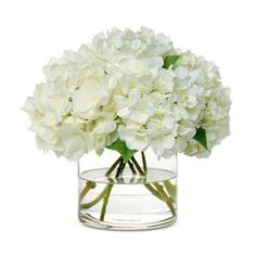 a vase filled with white flowers on top of a table