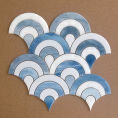 blue and white art deco tile on brown background