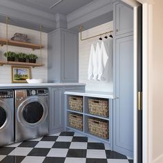 a washer and dryer in a room with black and white checkered floor