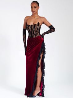 Live life like royalty with this divine piece! Featuring a strapless corset, high side slit, exposed velvet boning, and slight ruching details across the 'V' shaped waistline, it's sure to make you look and feel like a queen. Fully boned and lined with a nude-colored lining, this stunning dress is perfect for any special occasion. Now get out there and make an unforgettable statement! Pair it with our Rae Black Lace Opera-length Gloves! Available in black and red. Materials: Lace / Stretch Velve Corset Dress Formal, Party Maxi Dresses, Boudiour Poses, Split Dress Thigh, Velvet Patchwork, Velvet Corset, Ballroom Dancing, Strapless Corset, Maxi Dress Sale