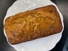 a loaf of bread sitting on top of a white plate