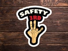 a sticker that says safety 3rd