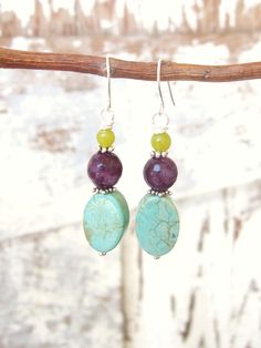 "These multi semi precious stone dangle earrings are made of oval green turquoise stones, round amethyst jade, yellow turquoise stones. I accented the stones with Bali sterling silver spacers. They measure 1 3/4\" in length from the top of the sterling silver earwire. Lightweight and comfortable for all day wear. Pair these with your other southwest jewelry or wear them on their own for a pop of color for your ears. See the matching BRACELET here: All my jewelry comes gift boxed with a bow ready Turquoise Gemstone Beads Earrings As Gift, Bohemian Jade Gemstone Earrings, Green Gemstone Beads Round Earrings, Green Round Gemstone Bead Earrings, Green Gemstone Beaded Round Earrings, Turquoise Jade Earrings With Natural Stones, Turquoise Gemstone Earrings With Round Beads, Green Gemstone Bead Drop Earrings, Green Oval Earrings With Natural Stones