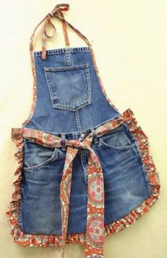 an apron made out of old jeans with a tie on the front and back straps