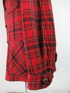 "Vintage 1970s Pendleton jacket. Made of red plaid wool. Has three pockets and a three button front. Made by Pendleton. Size medium. Actual measurements are: 46\" at the chest 44\" at the waist 19\" shoulder seam to shoulder seam 25\" shoulder seam to cuff 31\" overall length In very good condition except for a 1/8\" on left arm(photo)." Vintage Plaid Long Sleeve Outerwear, Vintage Plaid Long-sleeve Outerwear, Vintage Long Sleeve Plaid Outerwear, Plaid Wool Button-up Outerwear, Vintage Plaid Outerwear With Button Closure, Vintage Plaid Outerwear With Pockets, Winter Plaid Blazer With Buttons, Vintage Plaid Button-up Outerwear, Retro Plaid Outerwear With Button Closure