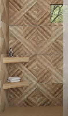 a modern bathroom with wood flooring and shelving units in the shower stall area