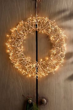 a lighted wreath hanging on the side of a door