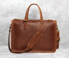 "New Style Personalized Leather Briefcase, Leather Messenger Bag, Full Grain Cowhide Handbag, Leather Laptop Bag, Crossbody Bag, Gift This bag is more suitable business man, lawyers, doctors, teachers etc, It's will be best companion for workiing school or travelling... Features: * Bag Size : L 16\" x H 11.4\" x D 3.5\"; * Made with The first layer of cowhide; * Full grain leather, retro style, simple, elegant and durable; * It's a great gift for friends, colleagues or family. Personalization: Stamping position: Front above center, Please refer to the picture for details. we can emboss up to 8 capital letters (including space). It can be Initials, name, or phrase, Just leave your emboss letters when purchasing. Personalized craft: Traditional hot stamping, not laser engraving! Our products Classic Laptop Bag With Adjustable Strap As Gift, Smooth Grain Satchel Laptop Bag For Daily Use, Daily Use Laptop Bag Satchel With Smooth Grain, Classic Bags With Smooth Grain As Gift, Rectangular Smooth Grain Satchel As Gift, Smooth Grain Leather Shoulder Satchel As Gift, Smooth Grain Satchel Shoulder Bag Gift, Cowhide Handbags, Leather Key Case