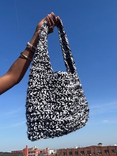 Black and White Crochet Shoulder Bag. Handmade by me <3 14in wide 17in tall (including strap) Bag stretches a bit when items are added Comes with magnetic snap closure Everyday Knitted Shoulder Bag, Everyday Knitted Tote Shoulder Bag, Knitted Shoulder Bag For Everyday Use, Everyday Knitted Rectangular Shoulder Bag, Casual Black Hobo Satchel, Rectangular Knitted Shoulder Bag For Everyday Use, Knitted Shoulder Bag For Travel, Black Hobo Satchel For Errands, Casual Black Hobo Bucket Bag