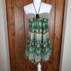 Trixxi Bubble Hem Halter Dress Size 9 Junior New With Tags! Strapless Style With Halter Tie Around Neck Polyester Chiffon Bubble Hem Dress Stretchy Lining And Blousy Style Hem Is Very Flattering All Measurements Taken Lying Flat, Unstretched Bust: 16" Length Down Center Of Back: 24.75" No Flaws To Note Smoke Free Closet Strapless Green Floral Print Mini Dress, Strapless Mini Beach Dress, Beach Strapless Mini Dress Lined, Green Strapless Mini Dress With Floral Print, Beach Mini Strapless Lined Dress, Strapless Lined Beach Mini Dress, Summer Beach Strapless Mini Dress, Spring Strapless Stretch Dress For The Beach, Spring Stretch Strapless Dress For The Beach