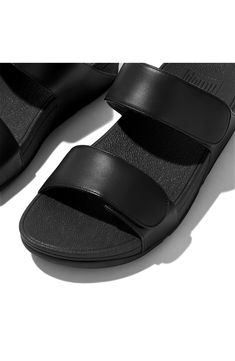 Adjustable leather straps refine a sporty slide sandal featuring a triple density midsole with ample cushioning to reduce pressure and support forward motion. 1 1/2" heel; 1" platform (size 9) Cushioning: absorbs impact and distributes weight for consistent, buoyant comfort under each step Leather upper/leather and synthetic lining/synthetic sole Imported Black Double Strap Sport Sandals With Cushioned Footbed, Modern Slides With Removable Insole And Double Strap, Black Sandals With Arch Support And Double Strap, Black Double Strap Sandals With Arch Support, Summer Black Slides With Gel Cushioning, Black Slides With Gel Cushioning For Summer, Modern Double Strap Slides With Cushioned Footbed, Leather Sport Sandals With Arch Support, Black Gel Cushioning Slides For Summer