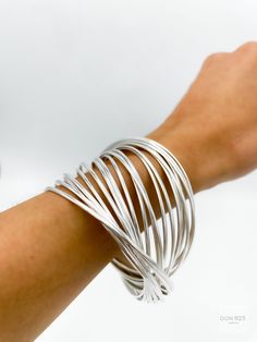 Silver Slinky Bangle Bracelets, Slinky Silver Bangle Bracelets, Silver Flexible Round Bangle, Slinky Bangle Jewelry As A Gift, Modern Silver Flexible Bangle, Plain Bangles, Interlocking Design, How To Clean Metal, Sterling Silver Bangle