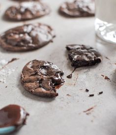 chocolate cookies and milk on a baking sheet