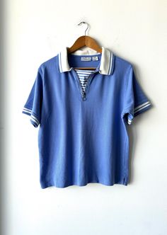 Women's Blue & White Short Sleeve Preppy Striped Tennis Golf Polo Shirt Onque  Size Large  Good vintage condition  100% cotton Authentic See all photos for measurements Affordable Retro Blue Shirt, Light Blue Cotton Polo Collar Tops, Tennis Shirt, Tennis Shirts, Blue Polo Shirts, Polo Golf, Blue Polo, Golf Polo Shirts, White Short