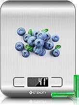 a digital scale with blueberries on it