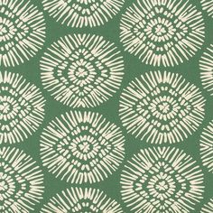 a green and white pattern on fabric