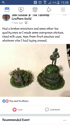 two small figurines sitting on top of green moss covered bases, one is broken and the other has fallen leaves