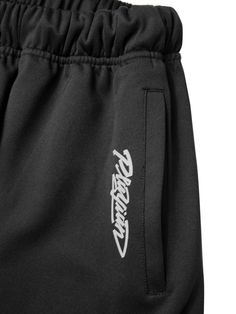 This is a casual and comfortable pants that are made out of high quality polyester and polyurethane blend fabric. With design detail of unique graphic print on the side and logo print beside the pocket, it gives a trendy and casual mood.- Elastic waistband with string- Side welt pockets- Logo print and graphic art print- Adjustable string and stopper on the hem Black Stretch Bottoms With Graphic Print, Black Techwear Sweatpants With Elastic Waistband, Black Joggers With Graphic Print For Streetwear, Black Graphic Print Joggers For Streetwear, Urban Black Sweatpants With Graphic Print, Urban Black Sweatpants With Letter Print, Black Urban Sweatpants With Letter Print, Black Casual Joggers With Graphic Print, Casual Black Sweatpants With Graphic Print