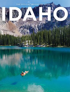 the cover of idaho's official travel guide, featuring a boat on a lake