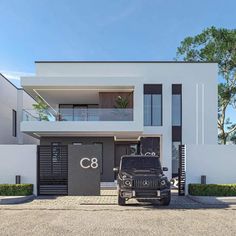 a black jeep parked in front of a white building