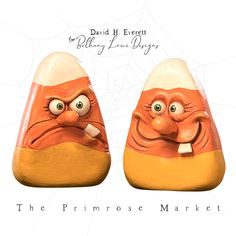 two ceramic orange and white shoes with eyes