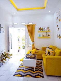 a living room filled with yellow furniture and white tile flooring, along with bright yellow drapes