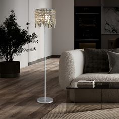 a living room scene with focus on the floor lamp and sofa in the foreground