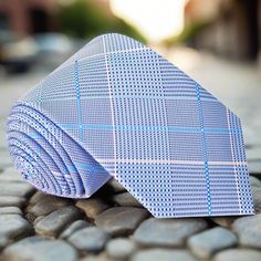 Light Blue Dapper Adjustable Blue Ties, Classic Blue Neckwear For Office, Dapper Blue Ties For Workwear, Blue Adjustable Formal Neckwear, Dapper Blue Standard Tie, Dapper Blue Business Ties, Blue Semi-formal Necktie, Elegant Fitted Plaid Ties, Blue Semi-formal Standard Tie